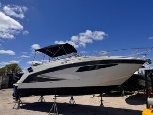 Glastron Boat sitting on stands