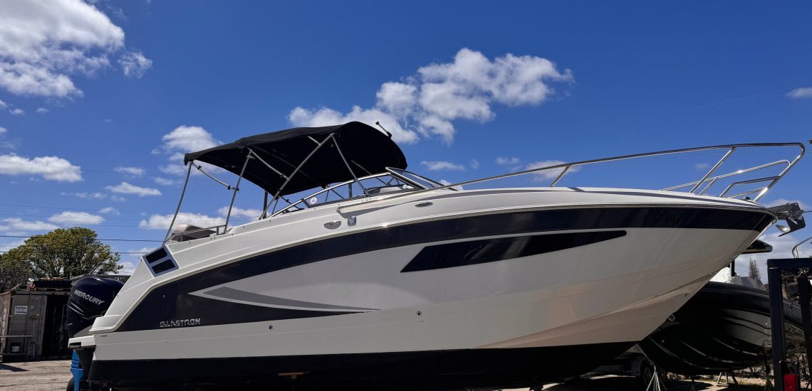 Glastron Boat sitting on stands